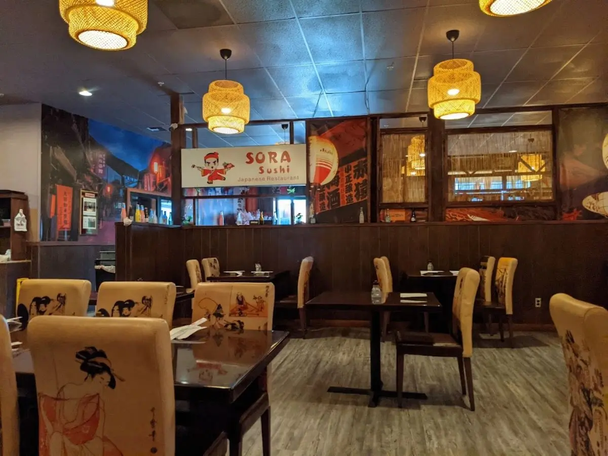 Dining tables and chairs with Japanese-style decor at Sora Sushi in Prineville